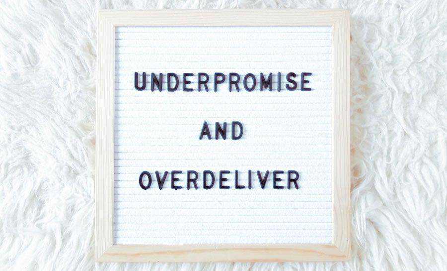 Under-promise over-deliver sign