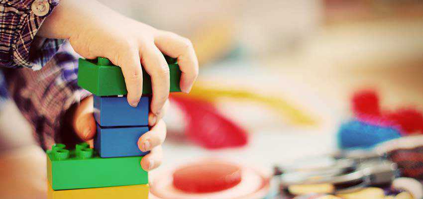 Child stacking blocks.