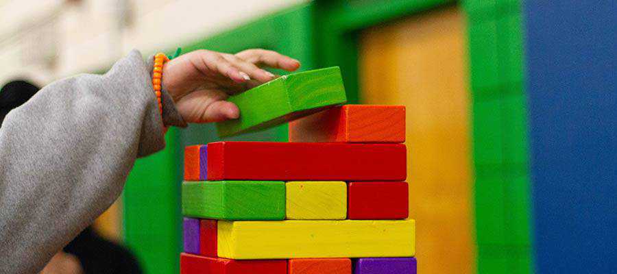 A person with toy blocks.